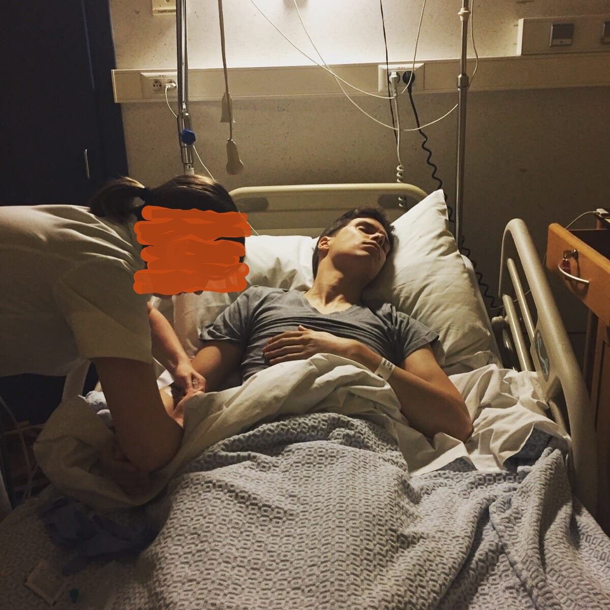 Polle asleep in a hospital bed after the surgery, a nurse checking on him